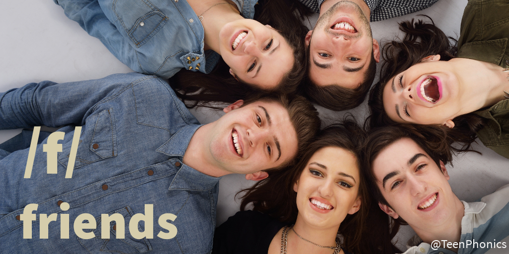A group of teens lying on the ground in a circle with their heads touching and smiling up at the camera exemplifies "friends", the word for the phoneme /f/.